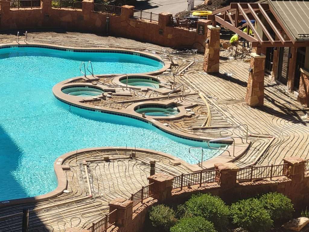 Intricately designed wooden water park with pools and bridges.