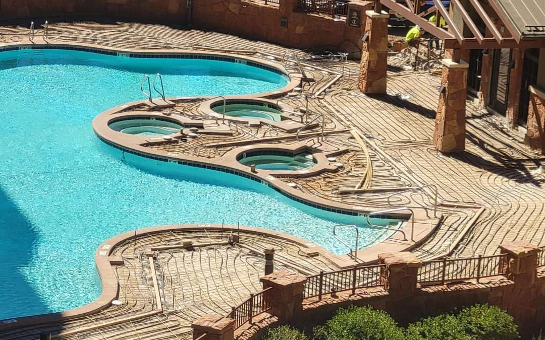 Intricately designed wooden water park with pools and bridges.